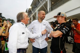 Stewart speaking with Kimi at Singapore, 2012